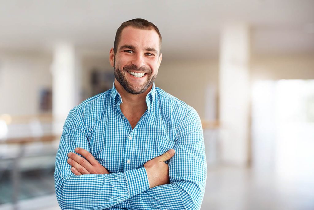 a person smiles after discovering a reason to quit drugs