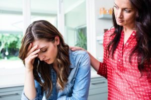 a person comforts another after they recognized they had signs you need rehab