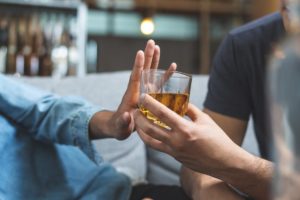 a person refuses a drink after learning how to quit drinking alcohol