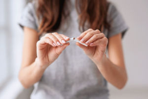 Hands of a person taklking about what works best to quit smoking