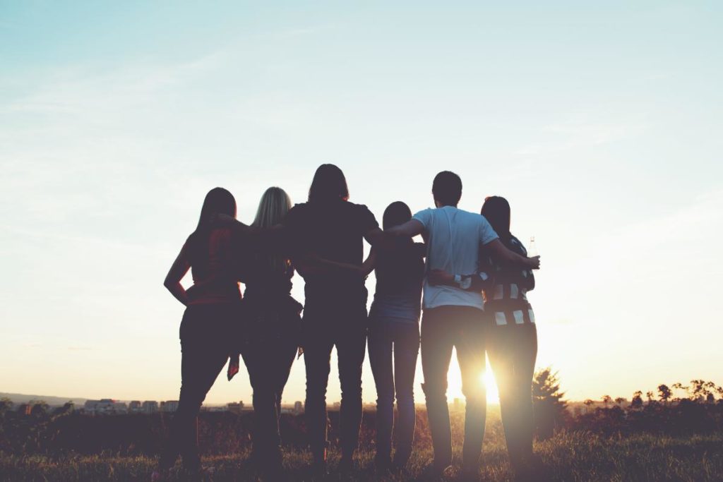 a group of people in narcotics anonymous watch the sunrise