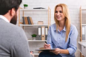 Two people discussing alcohol's effects on hormones