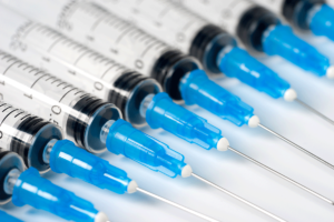 a row of sterile syringes like those at needle exchanges in idaho