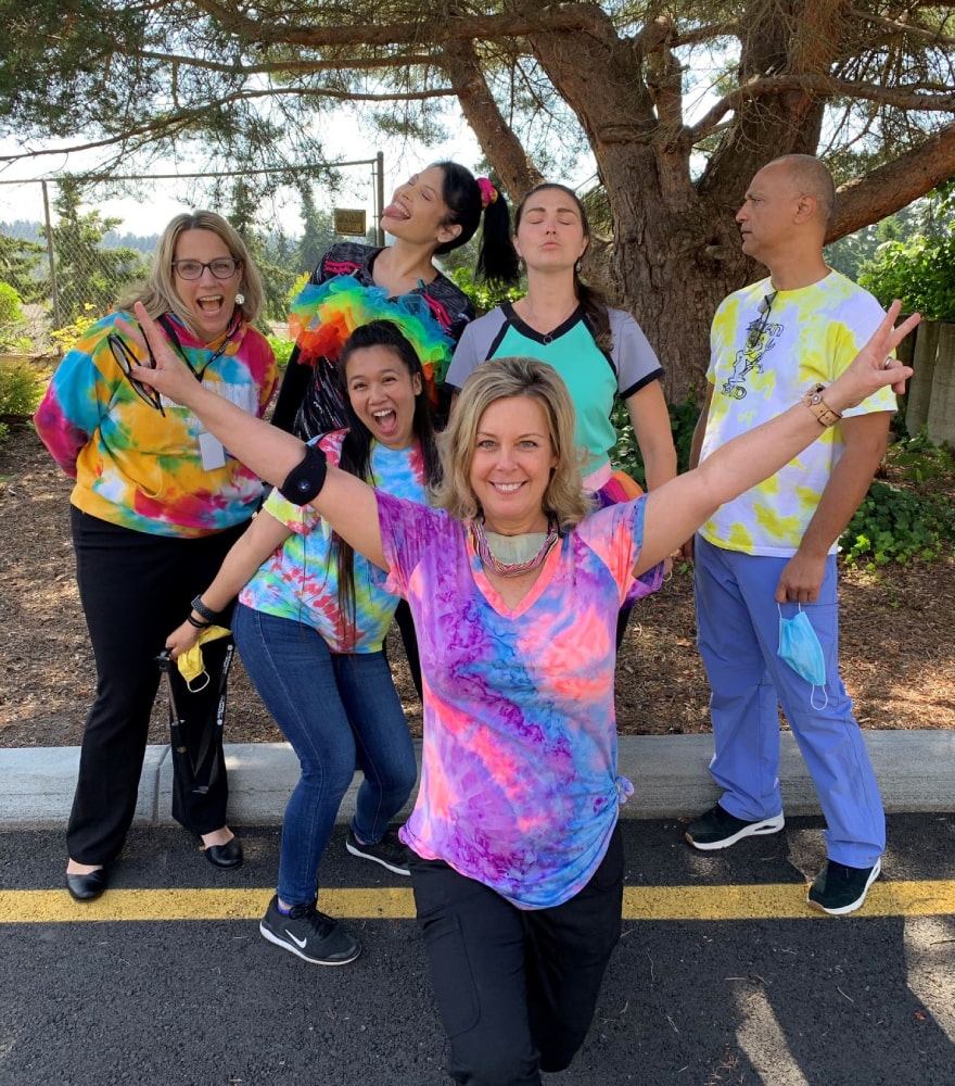 group-posing-with-colorful-shirts-on-roadside