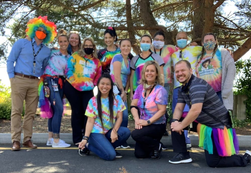 group-posing-with-colorful-shirts