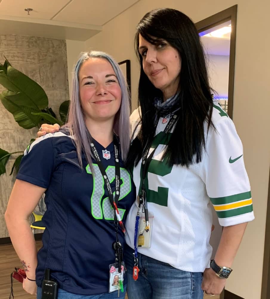 two-women-in-sports-shirts