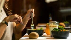Women practicing good nutrition in addiction recovery by eating tasty chicken salad with dessert
