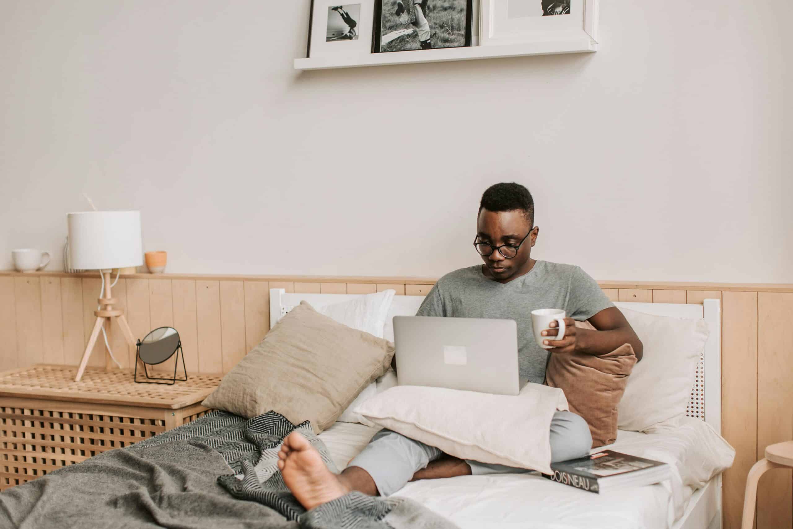 man in inpatient rehab sitting on bed