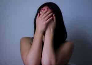 woman covering her hands